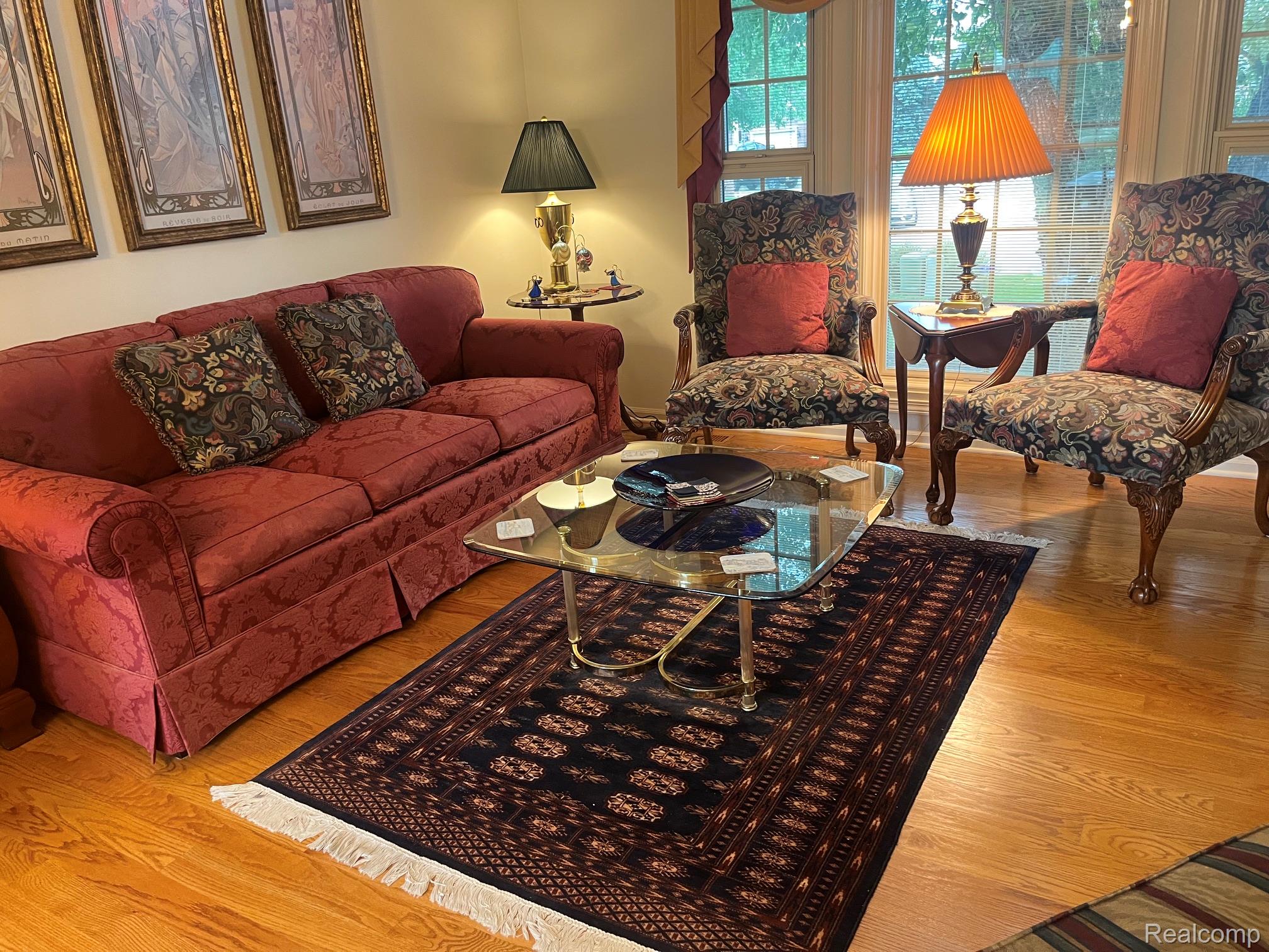 1708 Devonwood Drive Rochester, MI 48306 - Photo 66 of 70 Hardwood flooring, large multi-pane windows, and neutral wall tones.