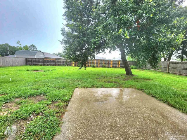 a view of backyard with green space