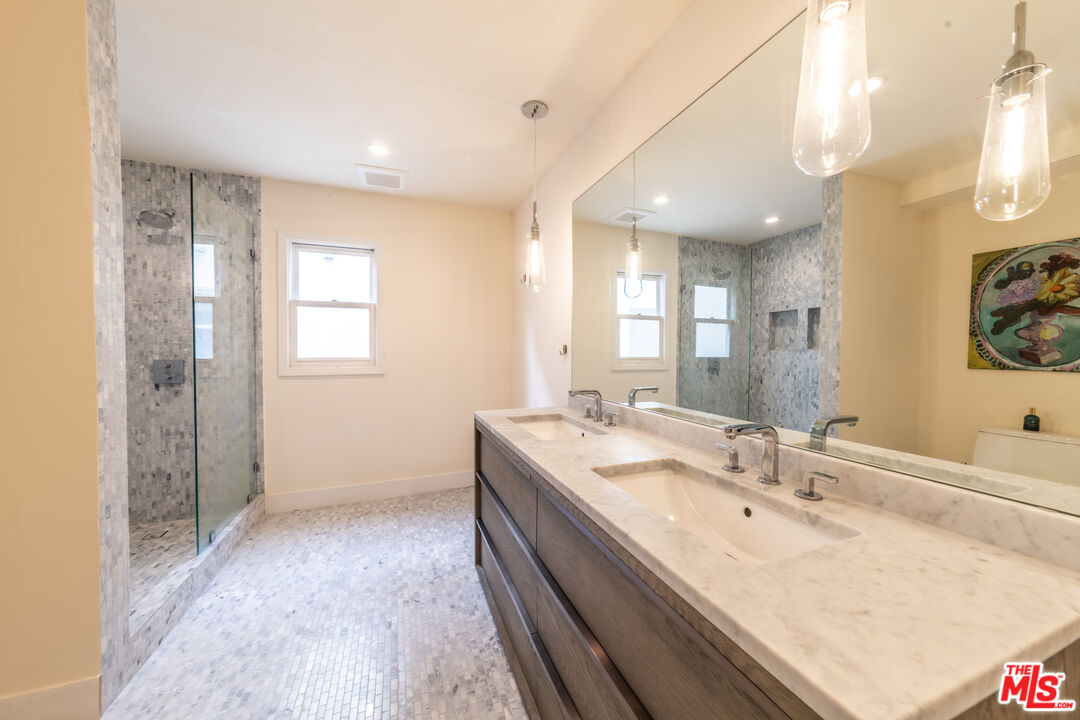 29 Lighthouse Street, Unit 3PH Venice, CA 90292 - Photo 16 of 25 a bathroom with a double vanity sink and a mirror