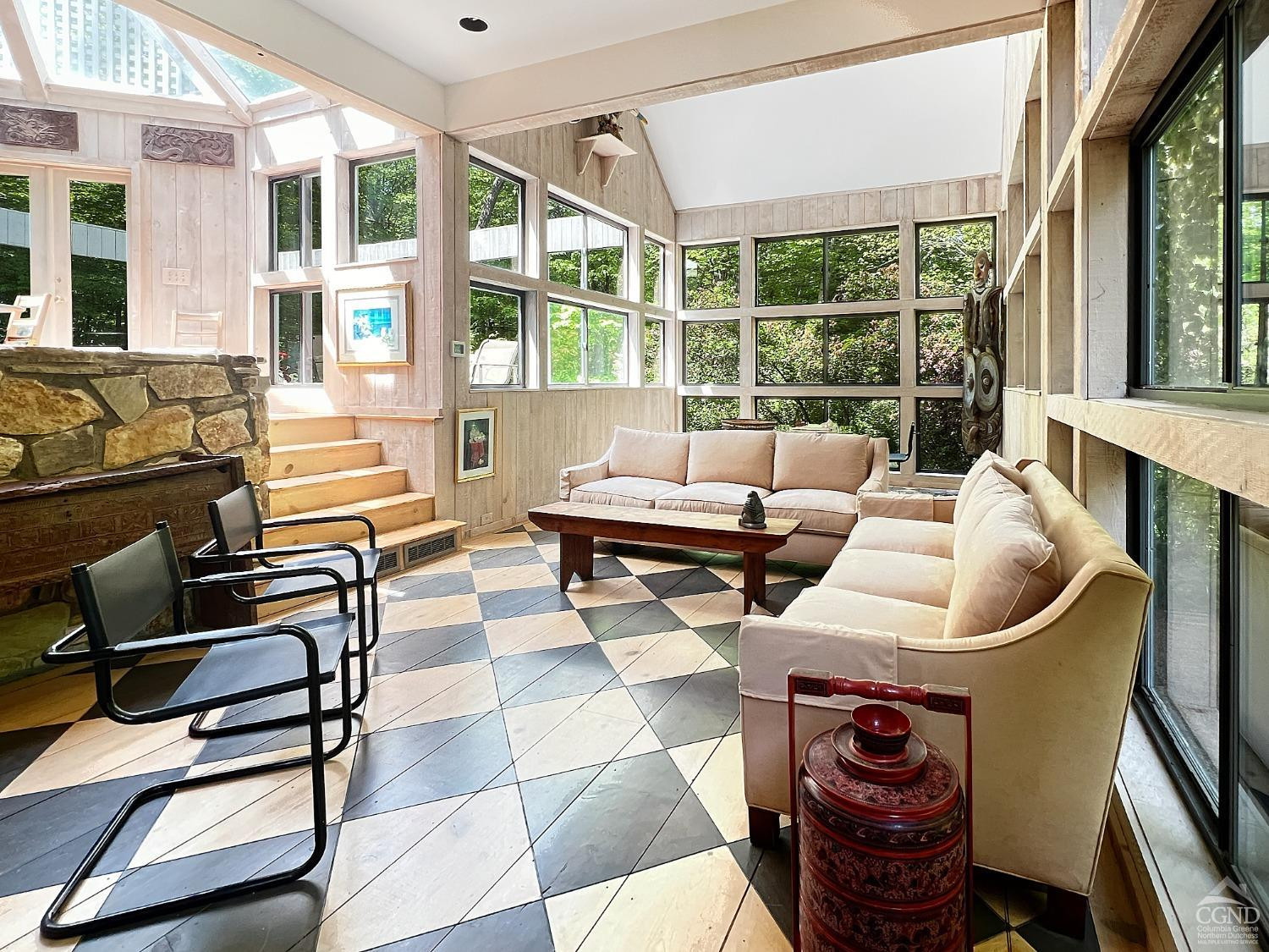 208 Cambridge Road Copake, NY 12529 - Photo 12 of 36 a living room with furniture and a floor to ceiling window