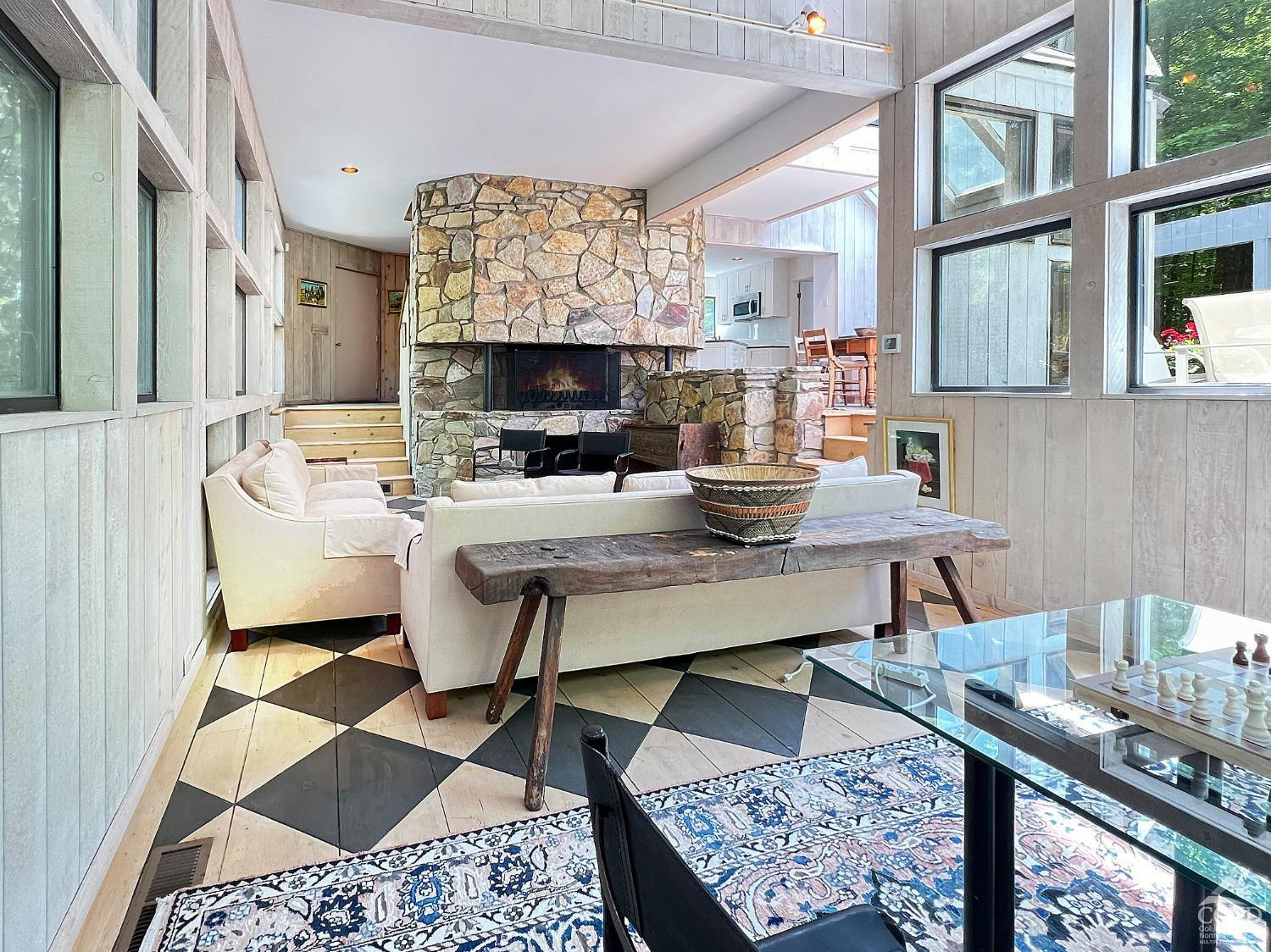 208 Cambridge Road Copake, NY 12529 - Photo 13 of 36 a living room with furniture a rug and a fireplace