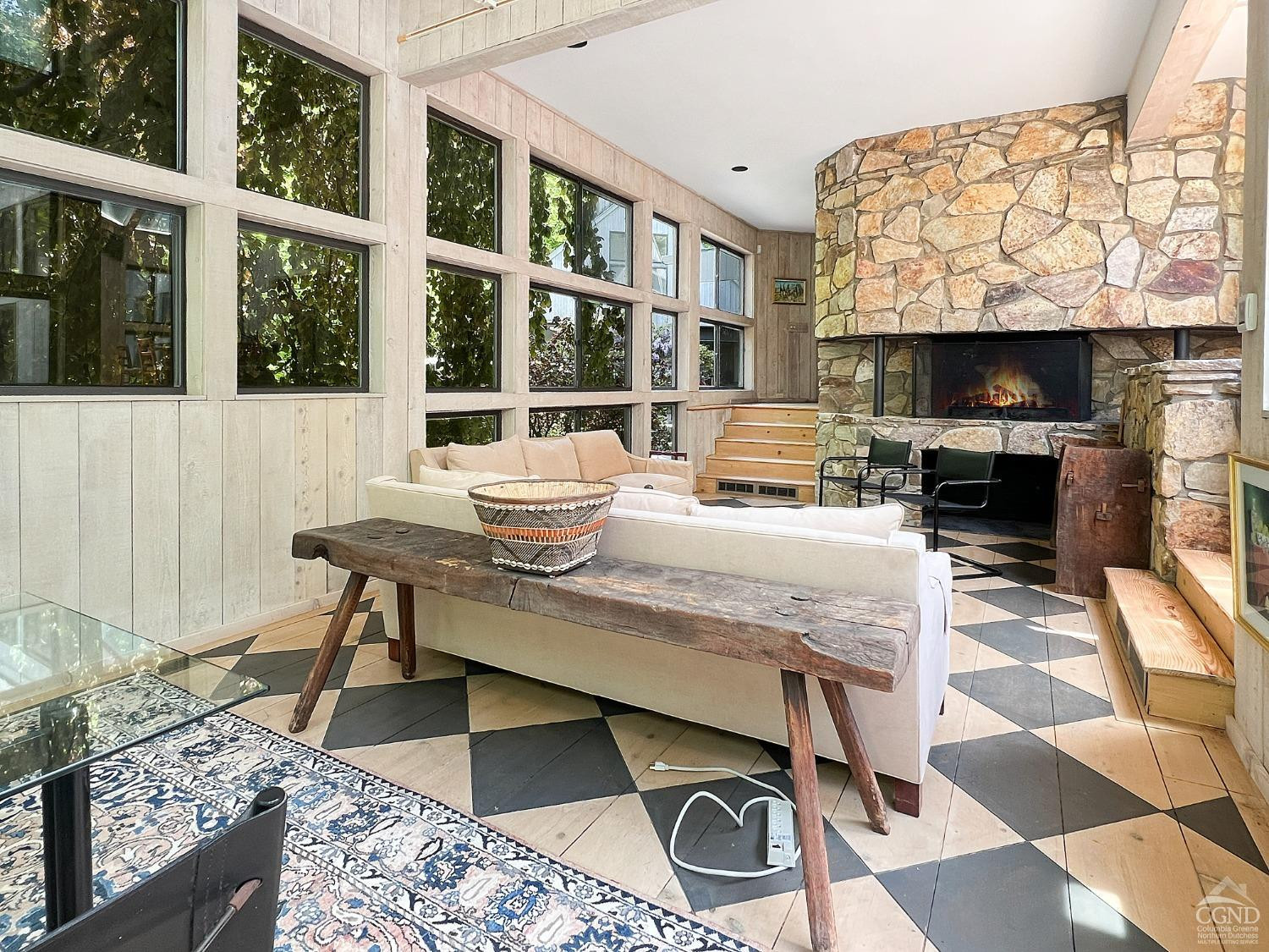208 Cambridge Road Copake, NY 12529 - Photo 14 of 36 a living room with fireplace furniture and a floor to ceiling window