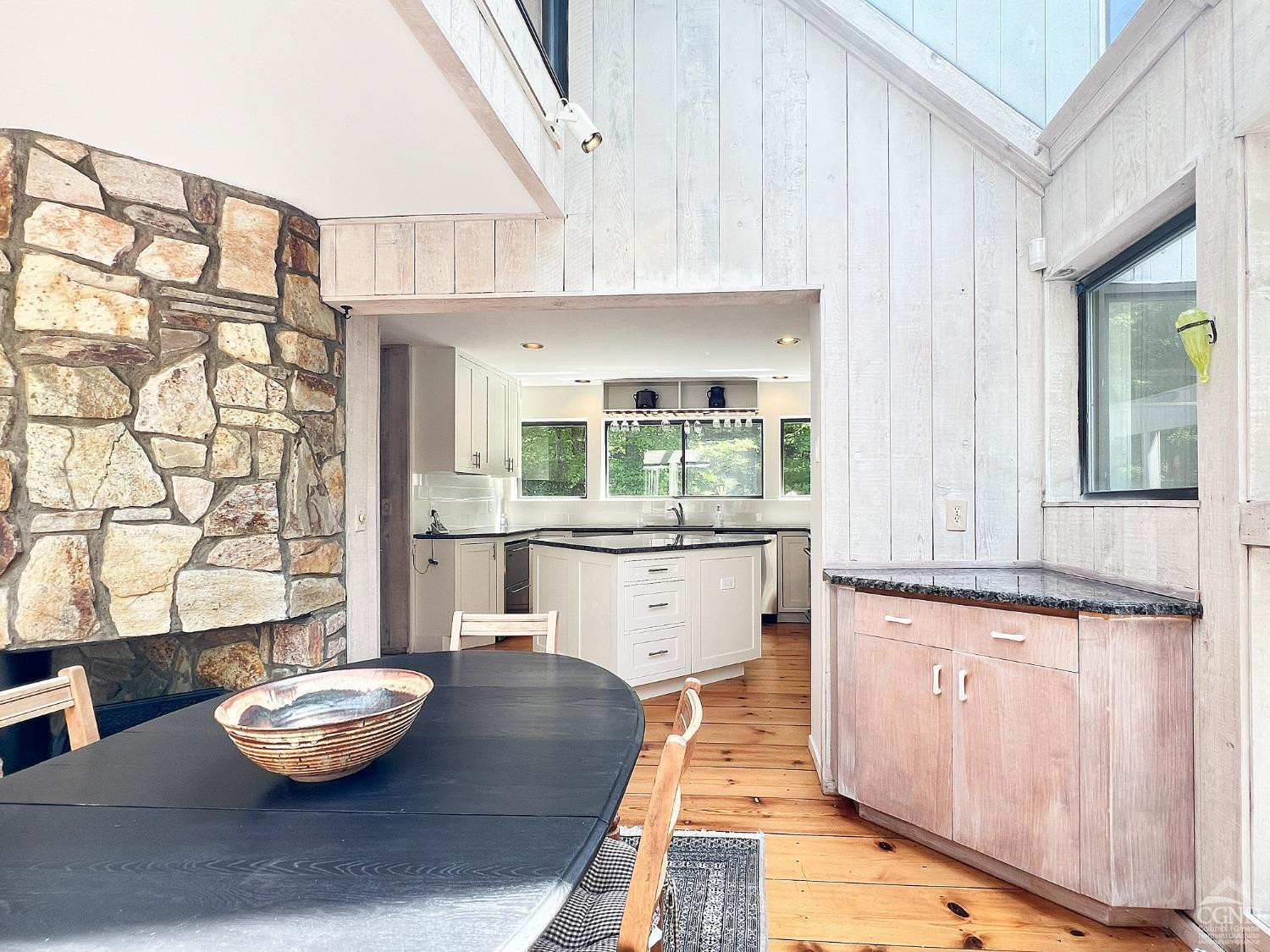 208 Cambridge Road Copake, NY 12529 - Photo 17 of 36 a kitchen with stainless steel appliances kitchen island a table and chair
