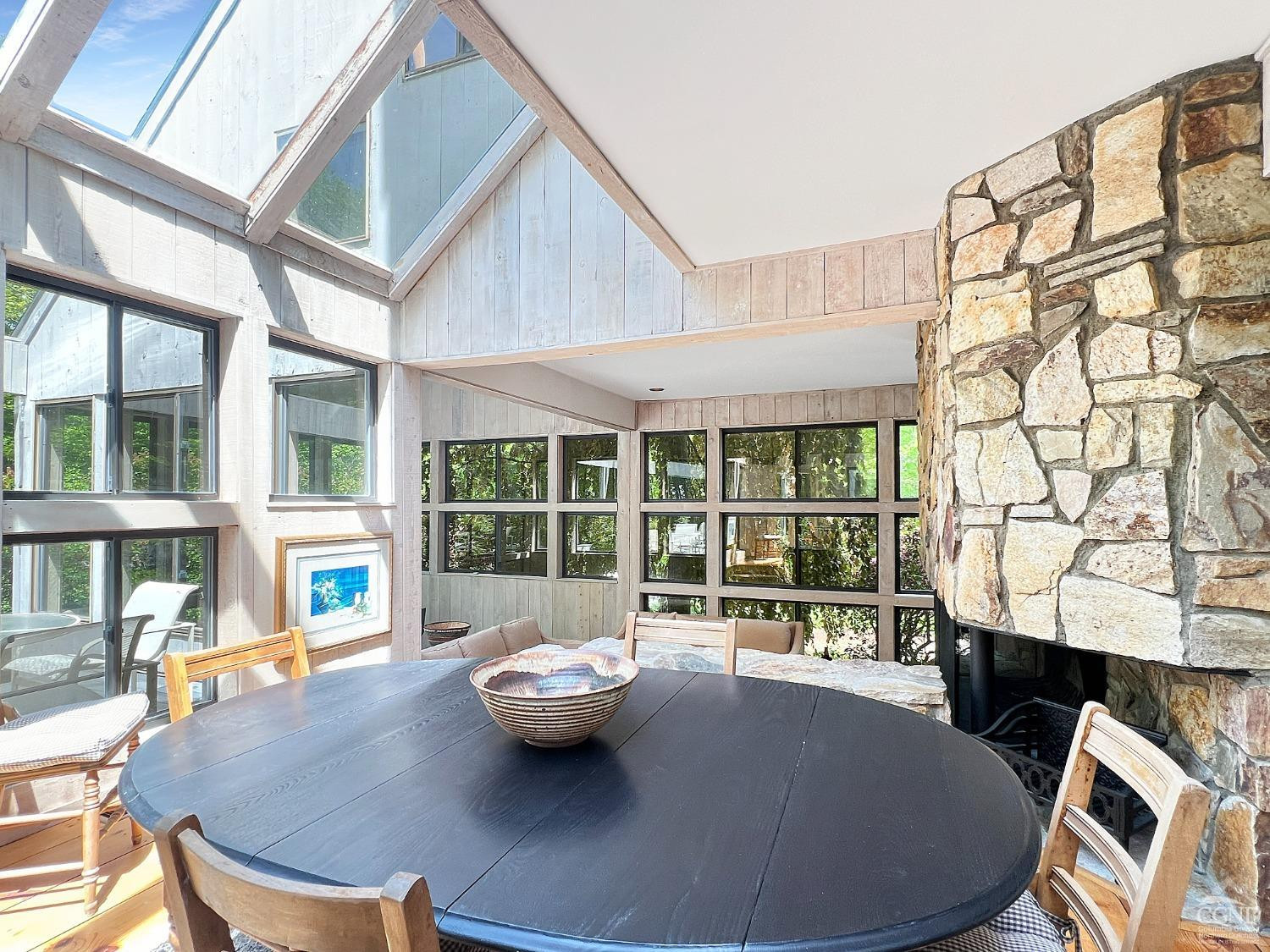 208 Cambridge Road Copake, NY 12529 - Photo 18 of 36 a view of a dining room with furniture large windows and wooden floor
