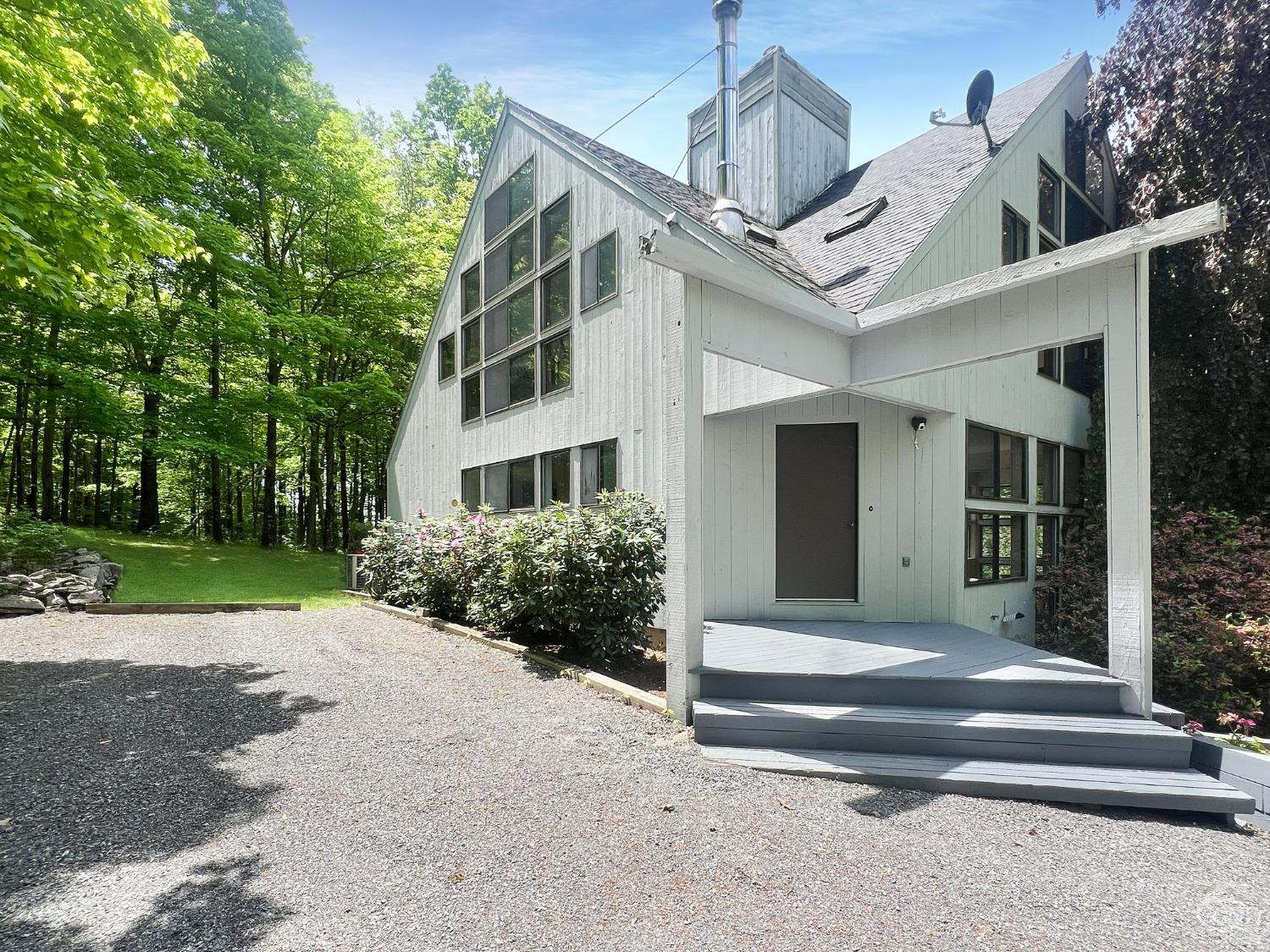 208 Cambridge Road Copake, NY 12529 - Photo 2 of 36 a front view of a house with a yard