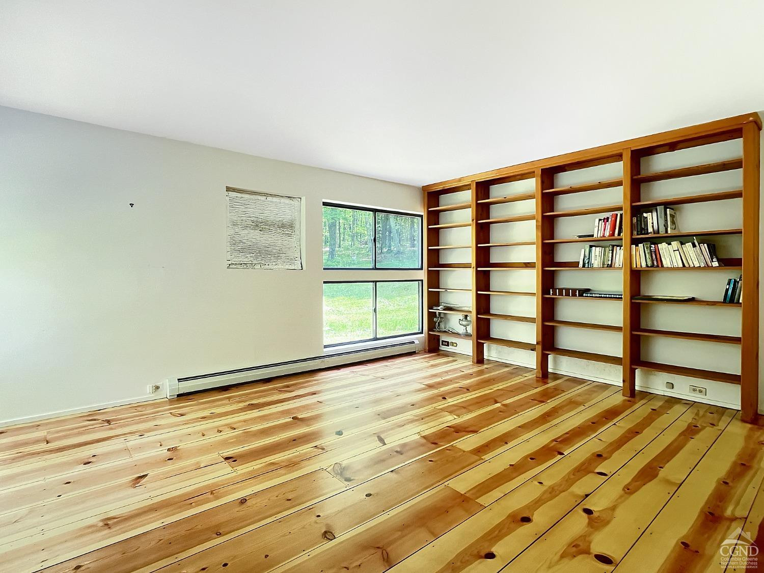208 Cambridge Road Copake, NY 12529 - Photo 30 of 36 a bedroom with a bed and a window