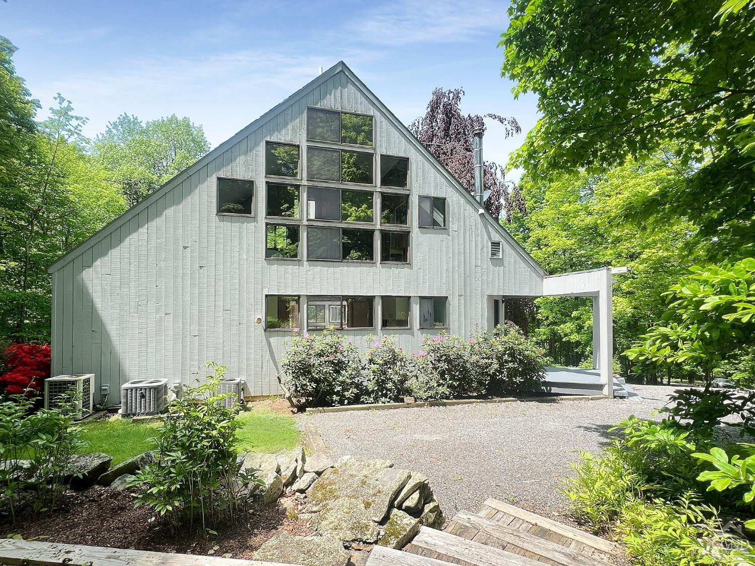 208 Cambridge Road Copake, NY 12529 - Photo 3 of 36 a front view of house with yard and trees around