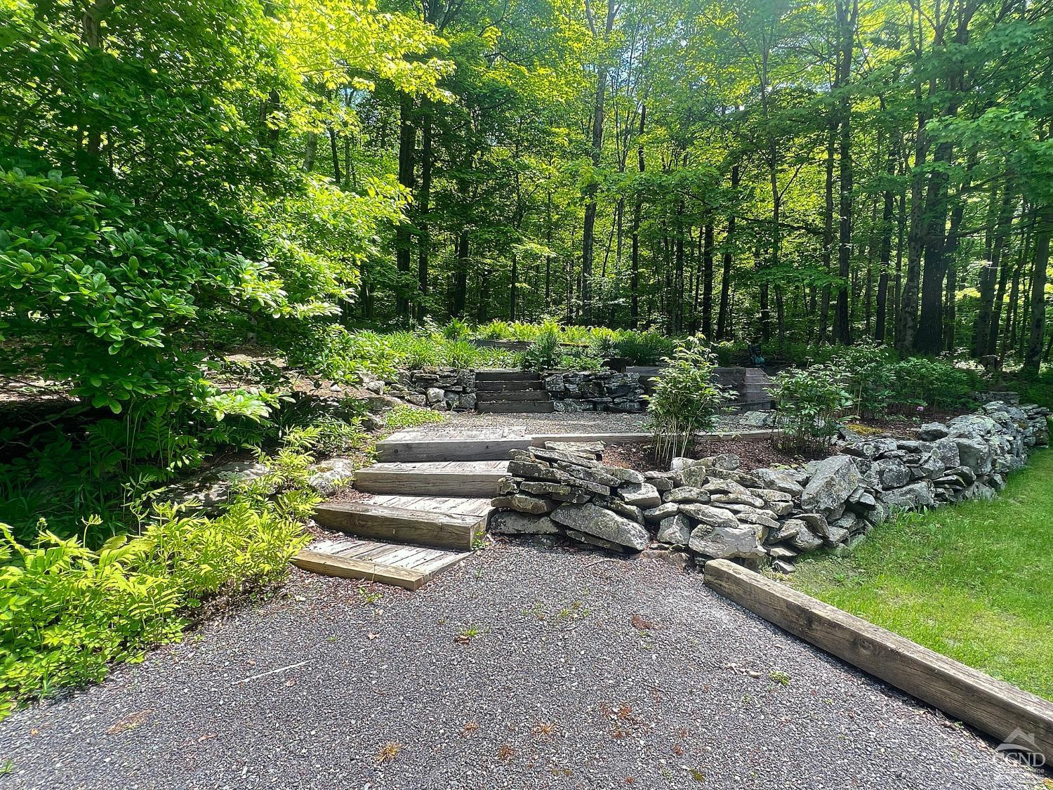 208 Cambridge Road Copake, NY 12529 - Photo 35 of 36 a view of a garden with plants and trees