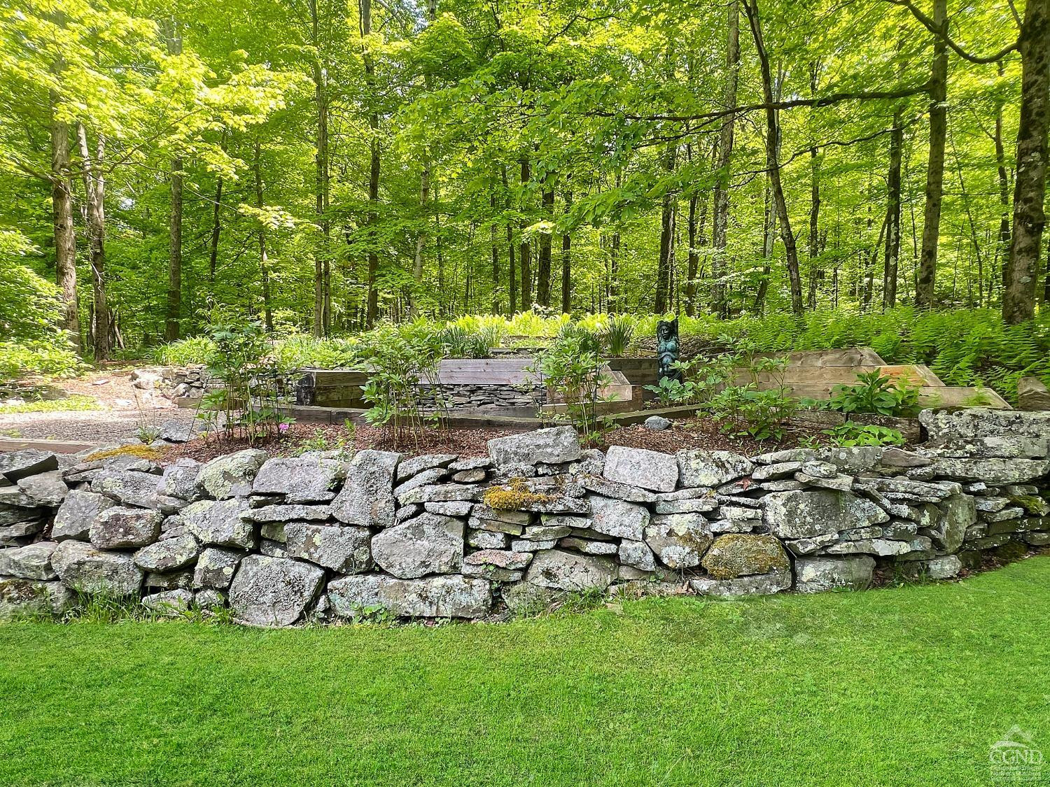 208 Cambridge Road Copake, NY 12529 - Photo 36 of 36 a garden with lots of trees and flowers