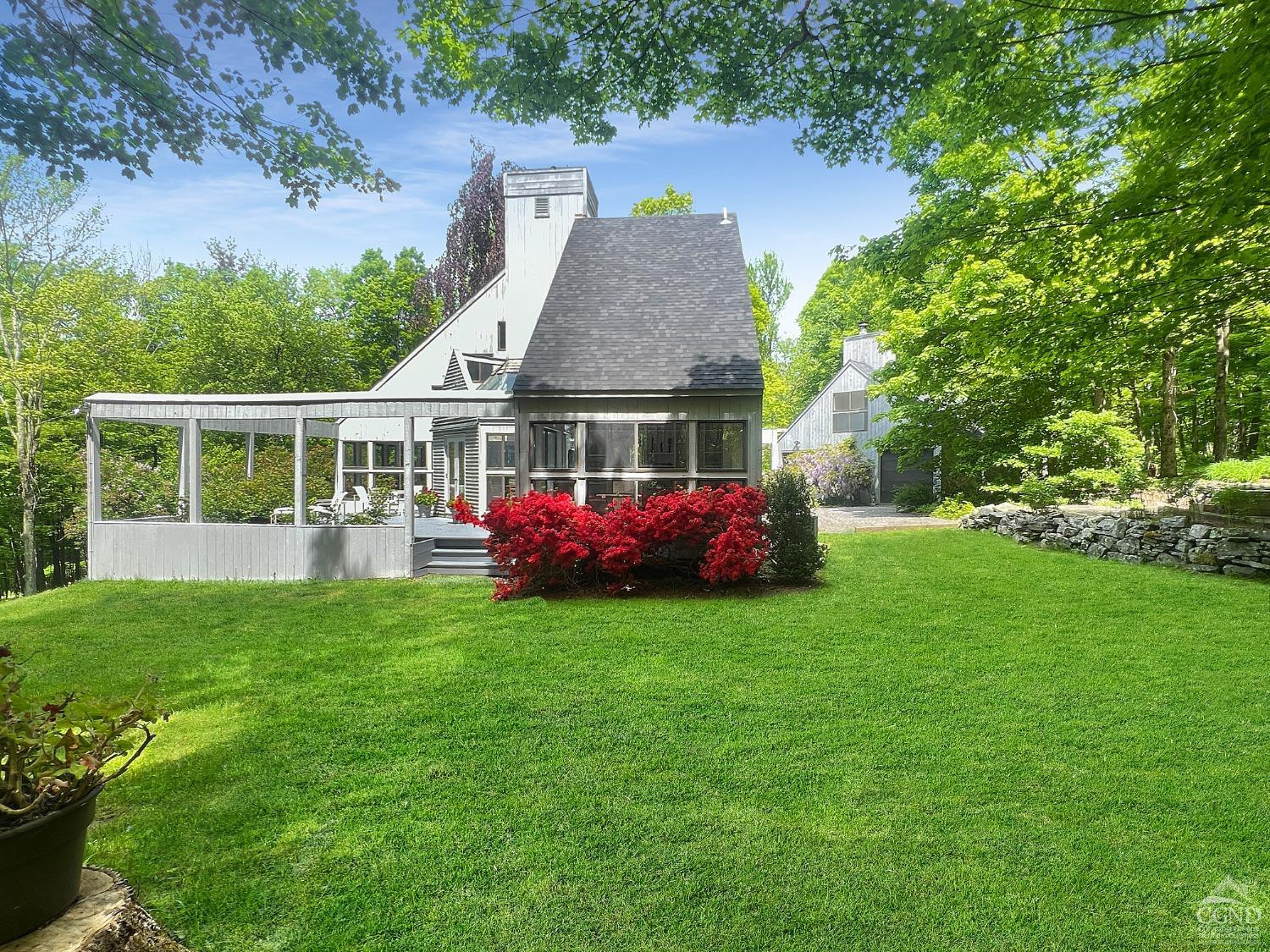208 Cambridge Road Copake, NY 12529 - Photo 5 of 36 a front view of a house with a garden