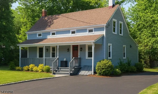 a view of a house with garden and yard