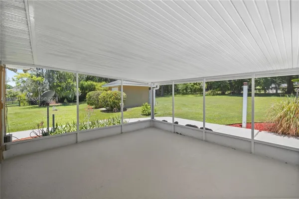 a view of a garden with an outdoor seating