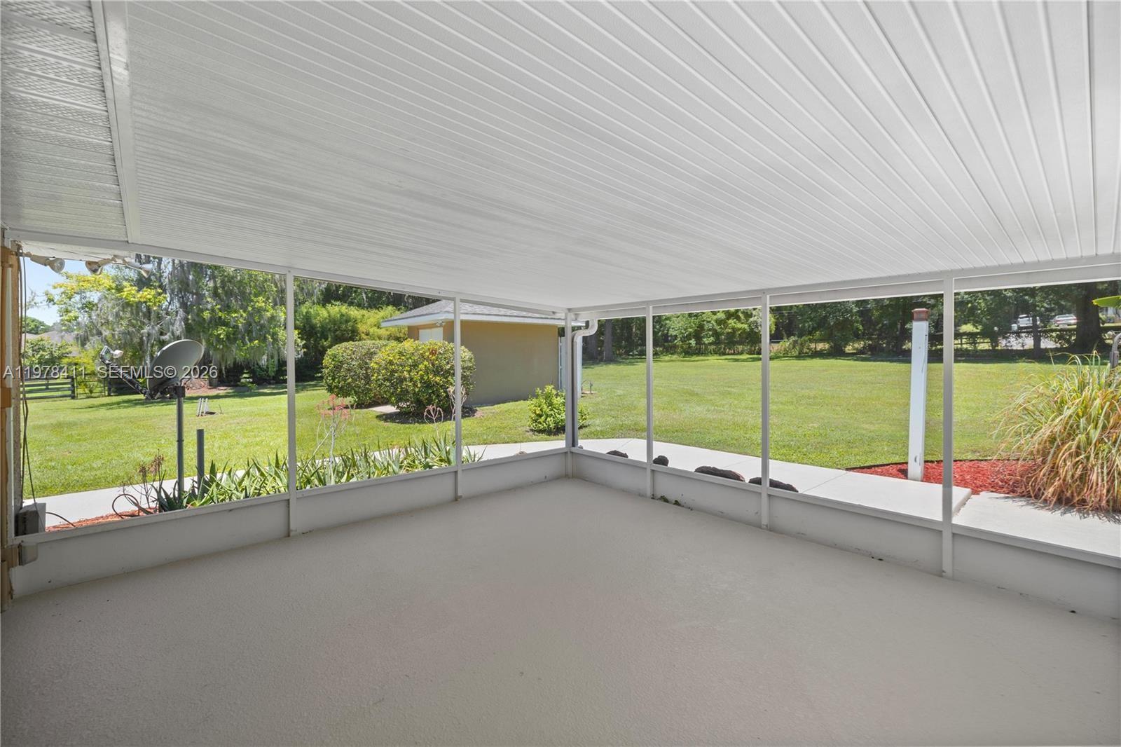 1699 Southwest 80th Street Ocala, FL 34476 - Photo 11 of 47 a view of a garden with an outdoor seating