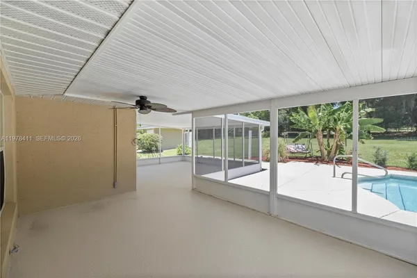 a view of empty room with floor to ceiling window