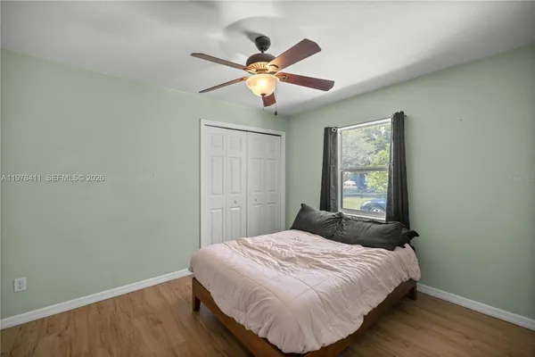 a bedroom with a bed and a window