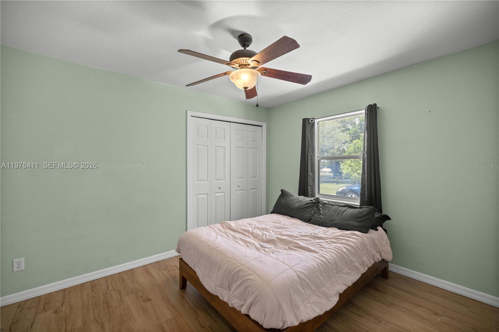 1699 Southwest 80th Street Ocala, FL 34476 - Photo 20 of 47 a bedroom with a bed and a window
