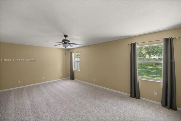 an empty room with a empty space and a window