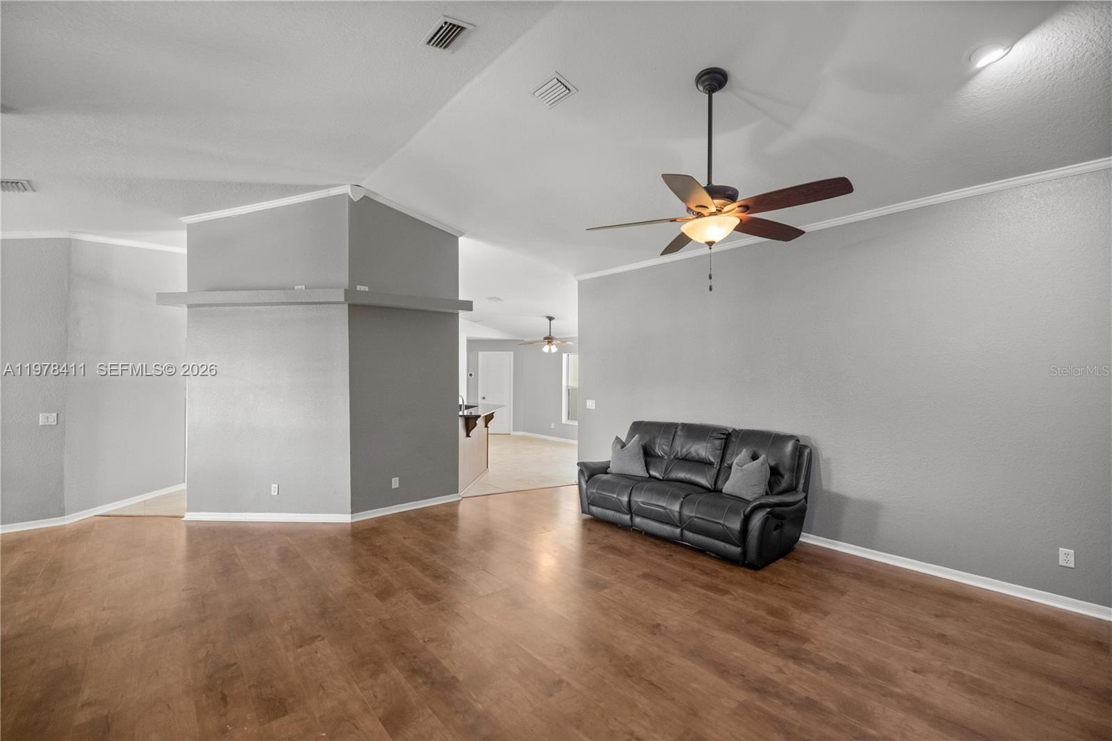 1699 Southwest 80th Street Ocala, FL 34476 - Photo 28 of 47 a view of a livingroom with furniture and a ceiling fan