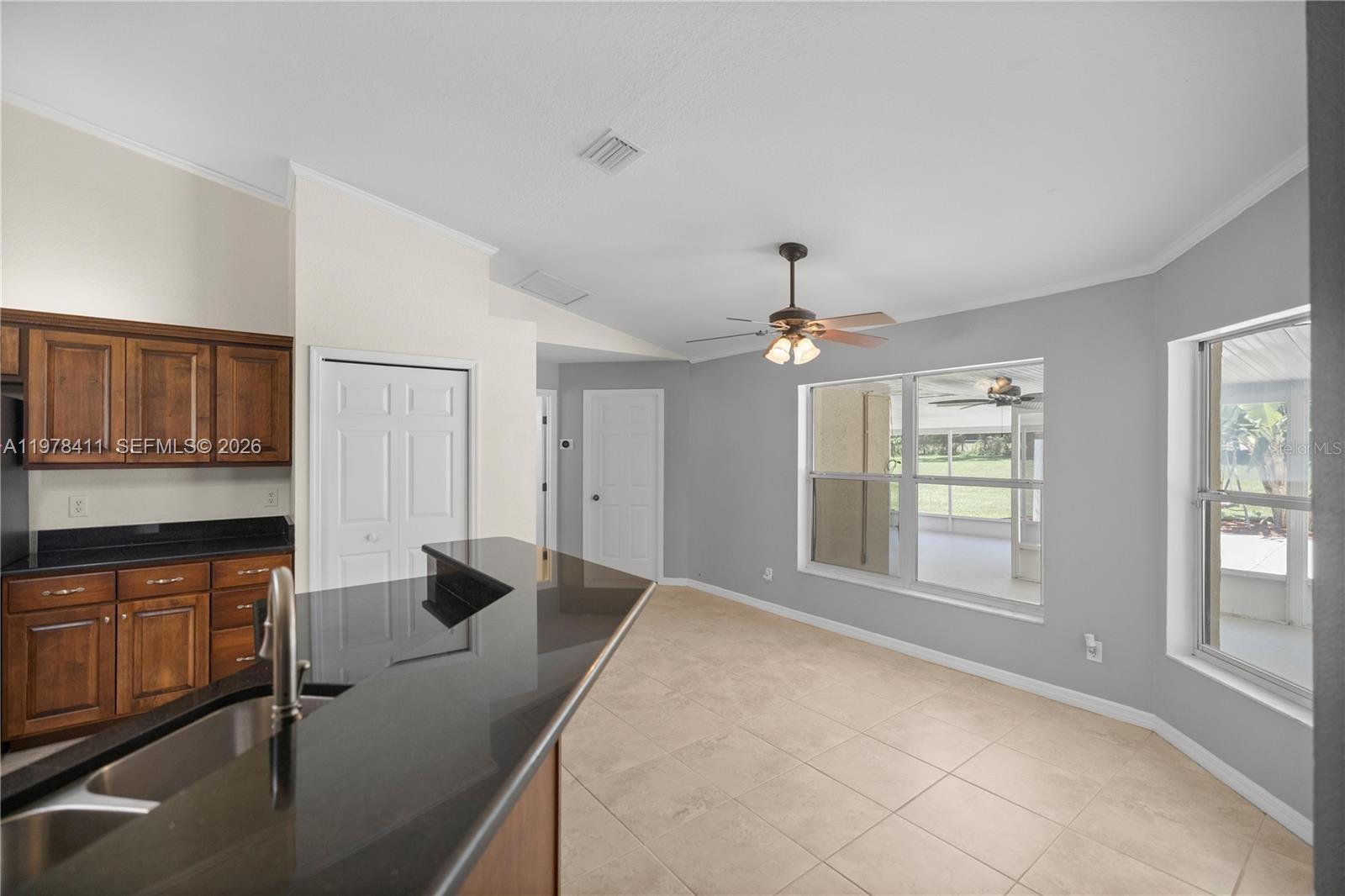 1699 Southwest 80th Street Ocala, FL 34476 - Photo 37 of 47 a spacious bedroom with a bed and a chandelier