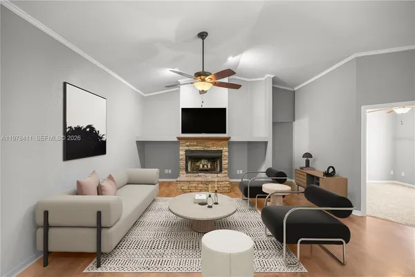 an aerial view of a residential houses with outdoor space and trees all around