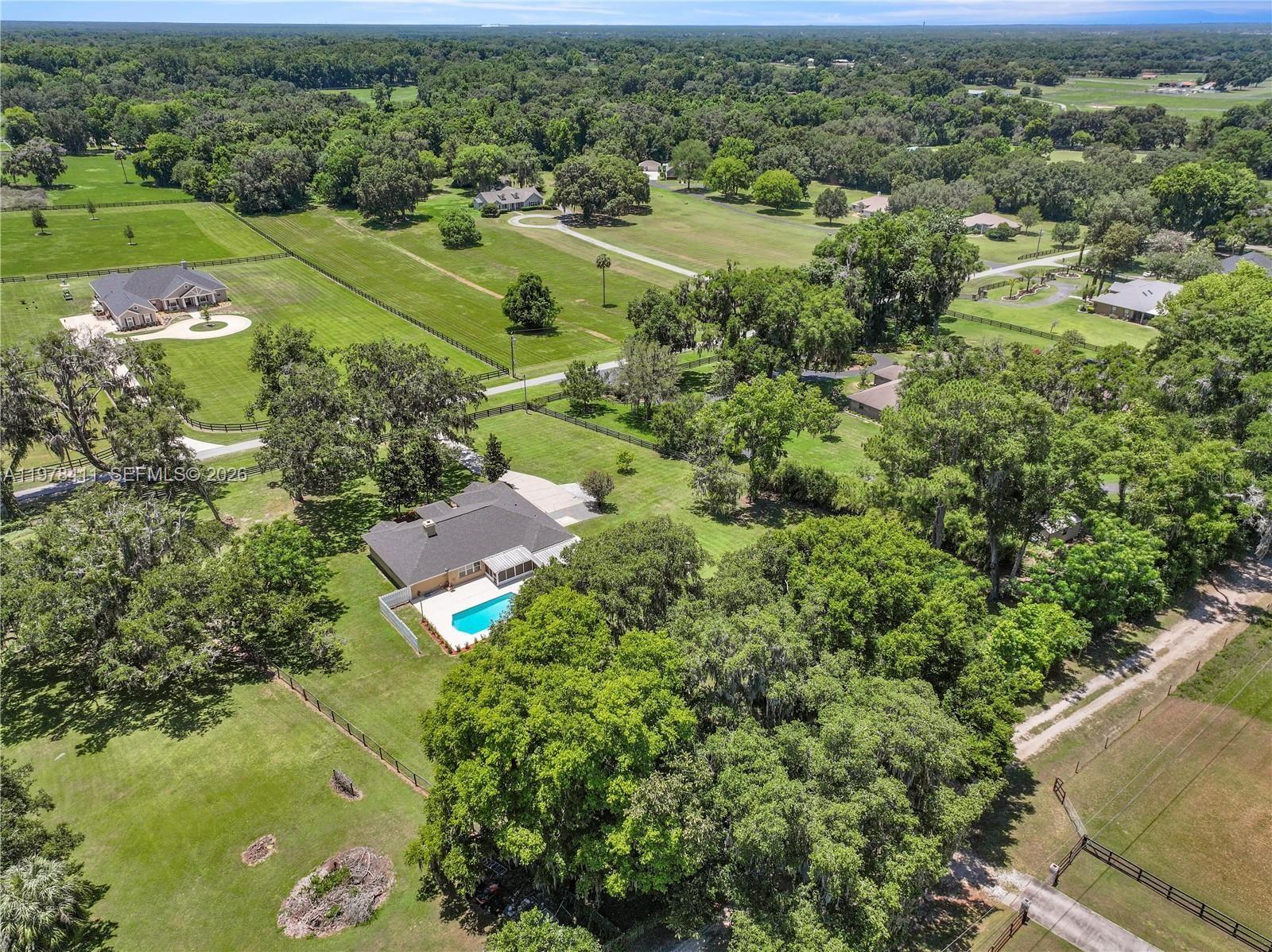 1699 Southwest 80th Street Ocala, FL 34476 - Photo 40 of 47 an aerial view of a residential houses with outdoor space and trees all around