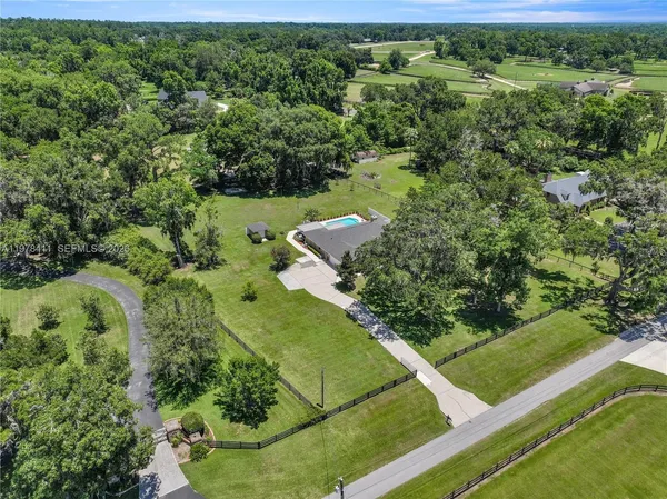 an aerial view of a houses with outdoor space and street view
