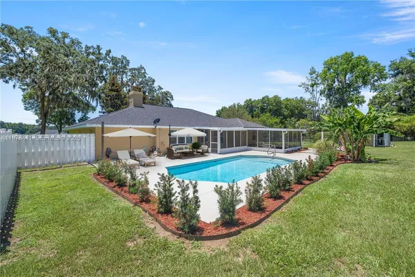 a view of a swimming pool with a garden