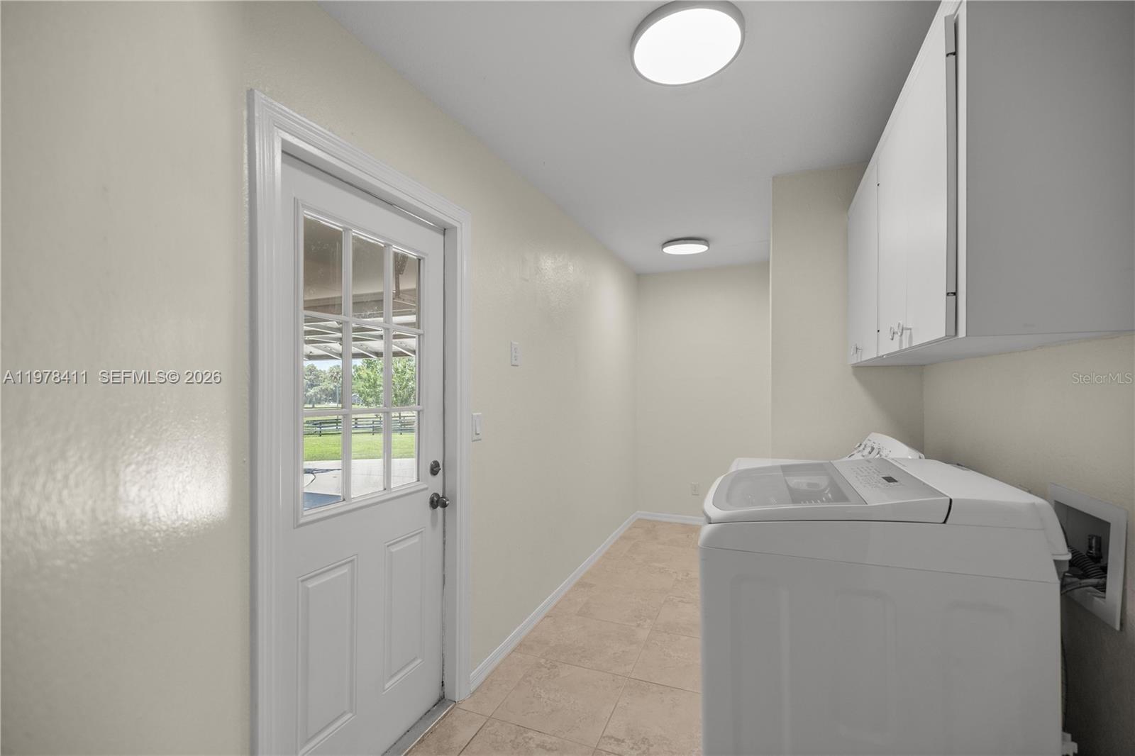 1699 Southwest 80th Street Ocala, FL 34476 - Photo 10 of 47 a utility room with closet dryer and washer
