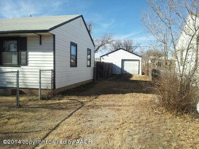 4604 Cline Road Amarillo, TX 79110 - Photo 7 of 7 a front view of a house with a yard