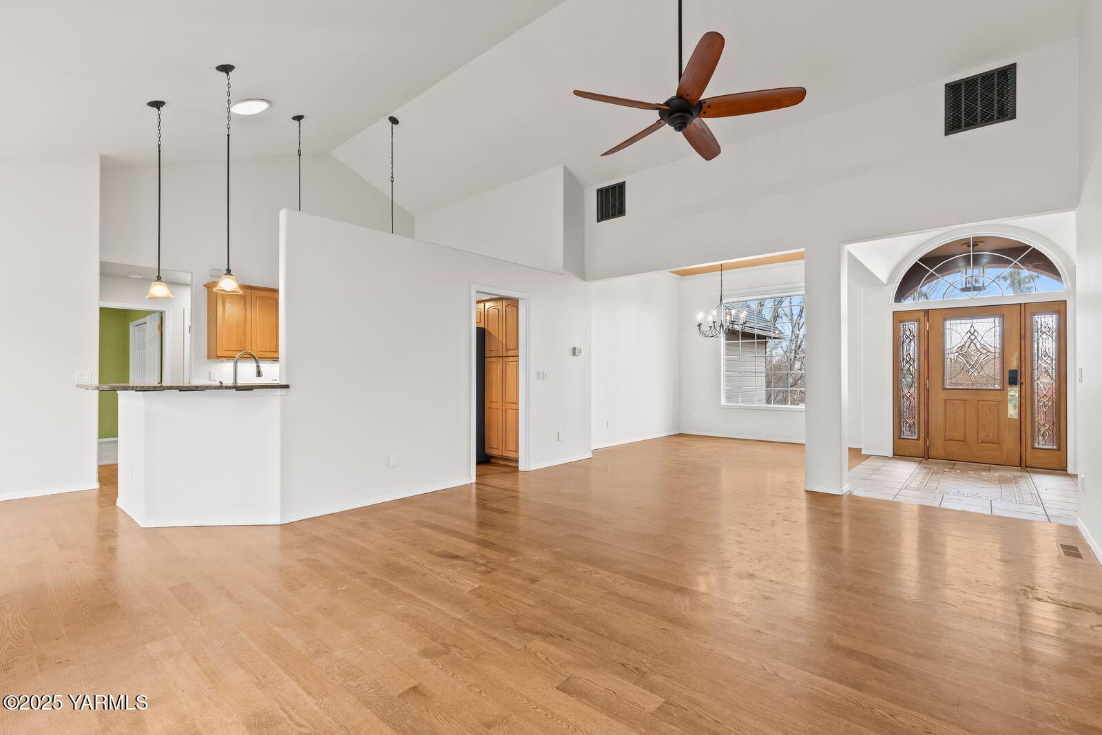 10709 Summitview Road Yakima, WA 98908 - Photo 13 of 32 a view of a room with wooden floor and white walls