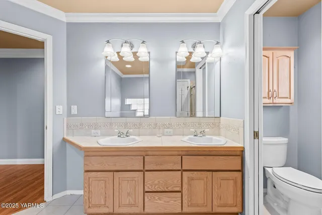 a bathroom with a sink vanity and a mirror