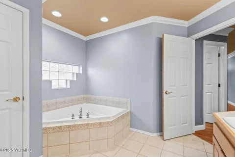a bathroom with a bathtub and shower