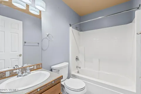 a bathroom with a bathtub and a sink