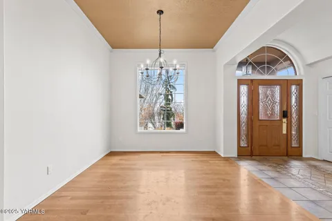a view of a room with window chandelier