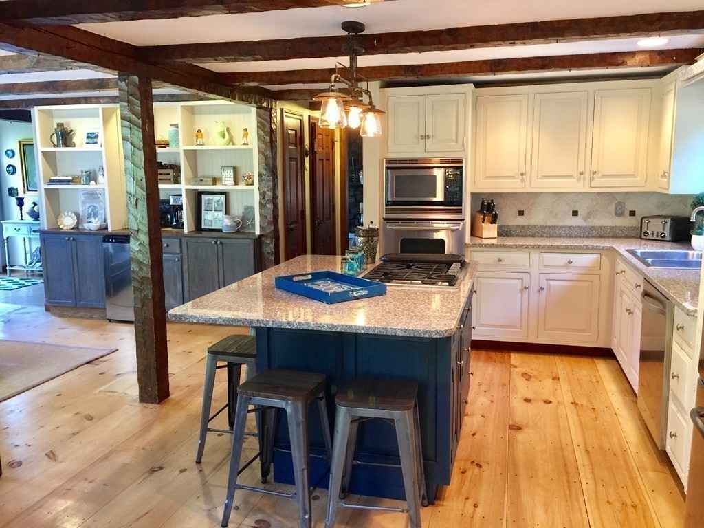 10 Wamsutta Road Scituate, MA 02066 - Photo 15 of 30 a kitchen with a sink a counter top space and stainless steel appliances