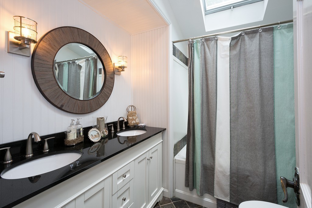 10 Wamsutta Road Scituate, MA 02066 - Photo 24 of 30 a bathroom with a sink and a mirror