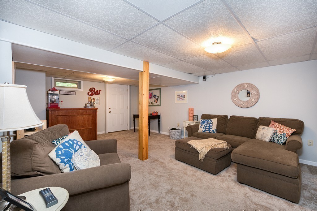 10 Wamsutta Road Scituate, MA 02066 - Photo 25 of 30 a living room with furniture and a wooden floor