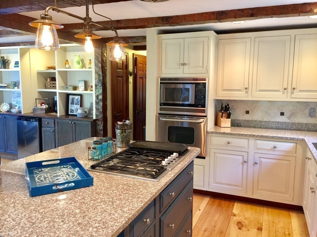 10 Wamsutta Road Scituate, MA 02066 - Photo 6 of 30 a kitchen with stainless steel appliances granite countertop a stove a sink and a microwave