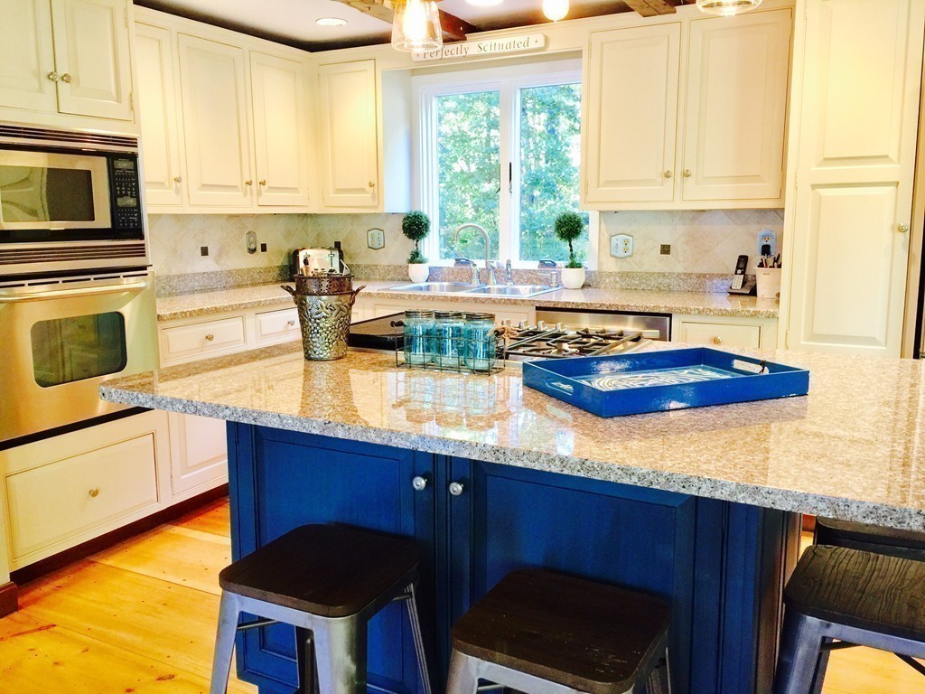 10 Wamsutta Road Scituate, MA 02066 - Photo 8 of 30 a kitchen with stainless steel appliances granite countertop a sink a stove and a microwave
