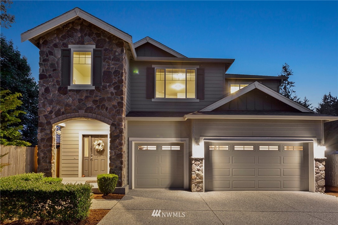 3408 223rd Place Southeast Bothell, WA 98021 - Photo 1 of 40 a front view of a house with a yard