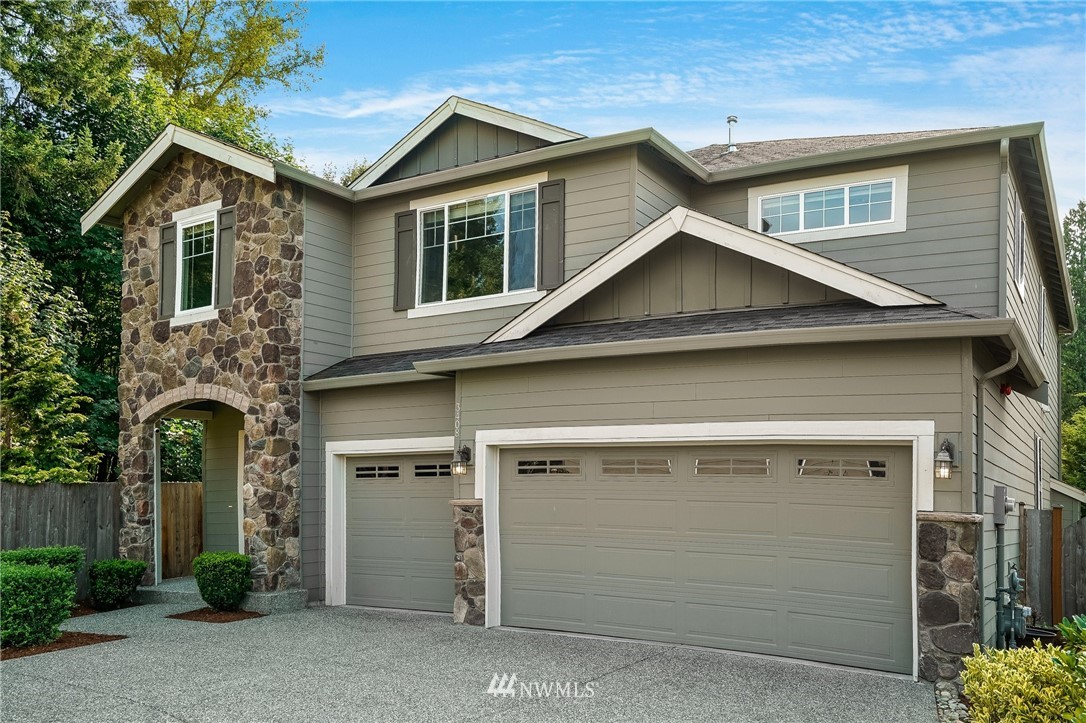 3408 223rd Place Southeast Bothell, WA 98021 - Photo 2 of 40 a view of a house with a yard and garage