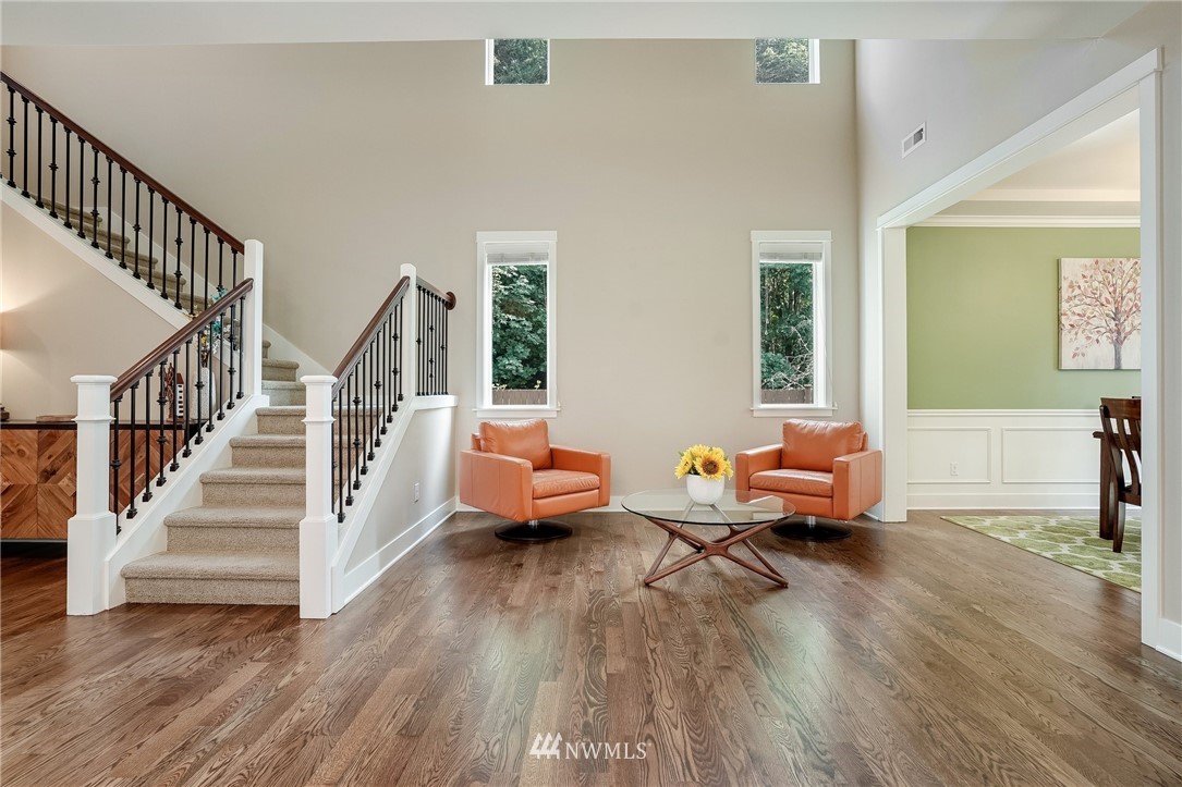 3408 223rd Place Southeast Bothell, WA 98021 - Photo 17 of 40 a living room with furniture and a wooden floor