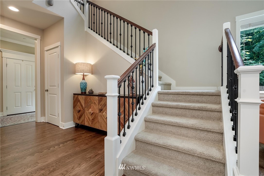 3408 223rd Place Southeast Bothell, WA 98021 - Photo 18 of 40 a view of entryway and hall with wooden floor