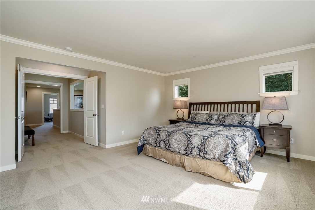 3408 223rd Place Southeast Bothell, WA 98021 - Photo 20 of 40 a bedroom with a bed and a mirror