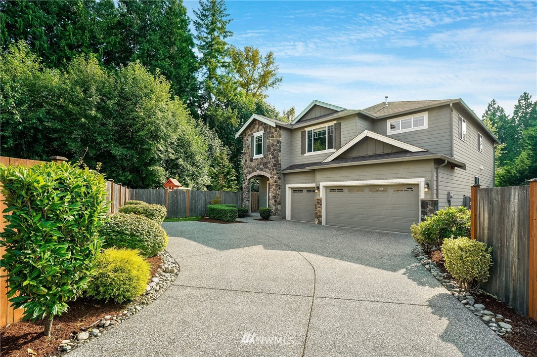 3408 223rd Place Southeast Bothell, WA 98021 - Photo 3 of 40 a front view of a house with a yard