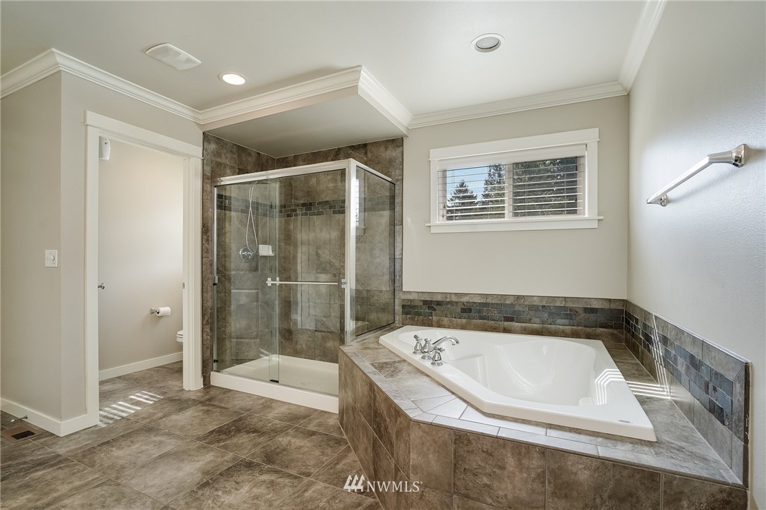 3408 223rd Place Southeast Bothell, WA 98021 - Photo 23 of 40 a bathroom with a bathtub and shower