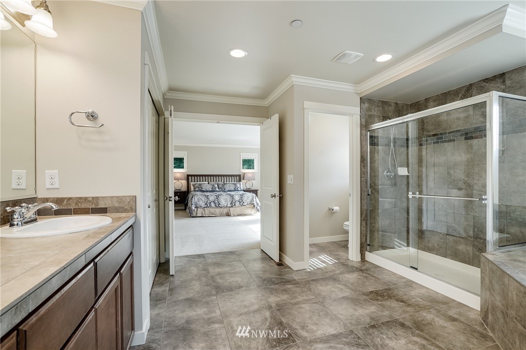 3408 223rd Place Southeast Bothell, WA 98021 - Photo 24 of 40 a bathroom with a sink and a mirror