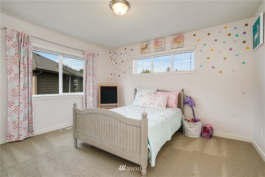 3408 223rd Place Southeast Bothell, WA 98021 - Photo 28 of 40 a bedroom with a bed and a window