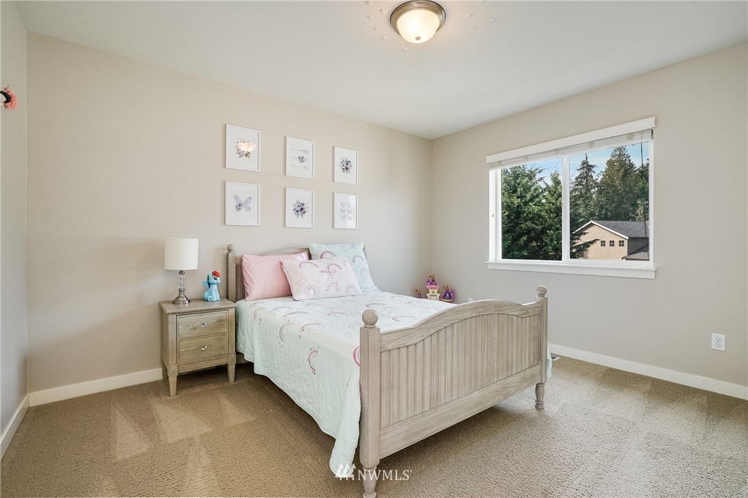 3408 223rd Place Southeast Bothell, WA 98021 - Photo 30 of 40 a bedroom with a bed and window