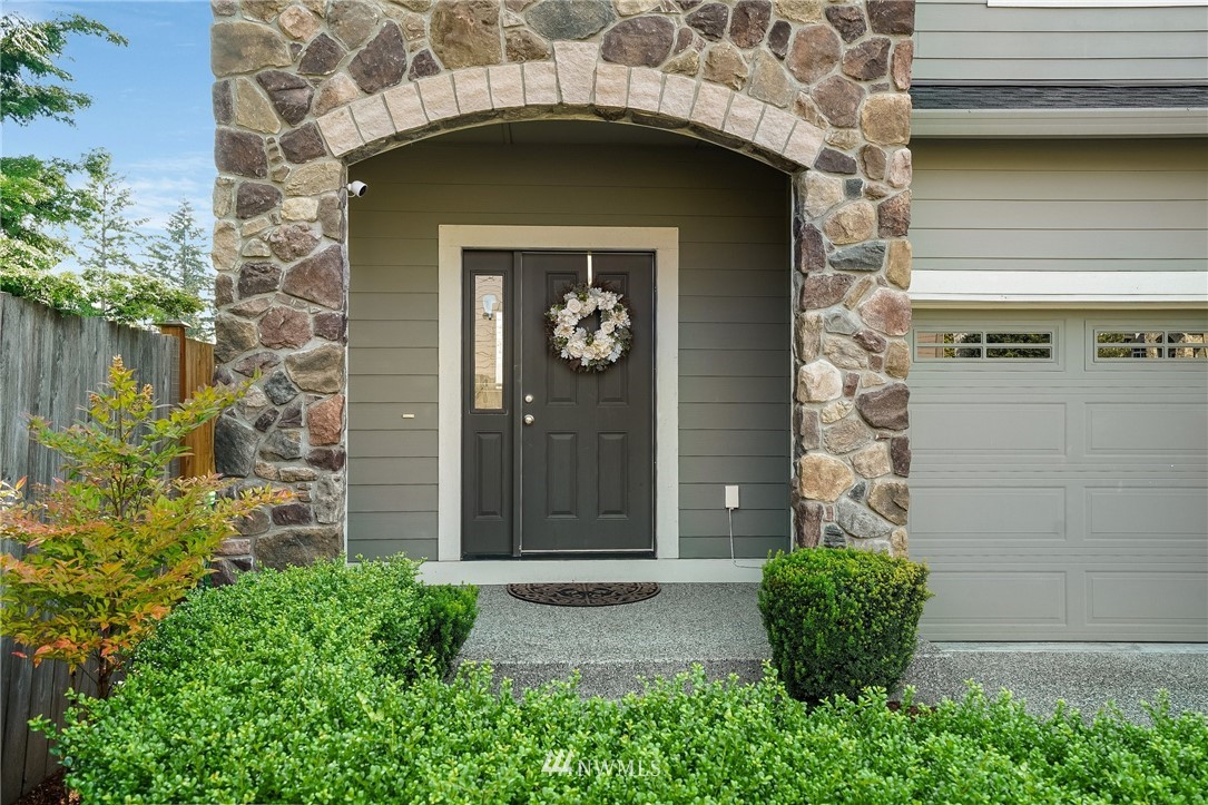 3408 223rd Place Southeast Bothell, WA 98021 - Photo 4 of 40 a front view of a house with a garden